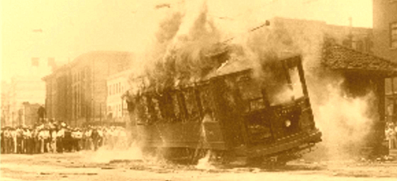 TodayInNewOrleansHistory/1929July1StreetcarStrikeCarBurningOnCanalStreet.gif