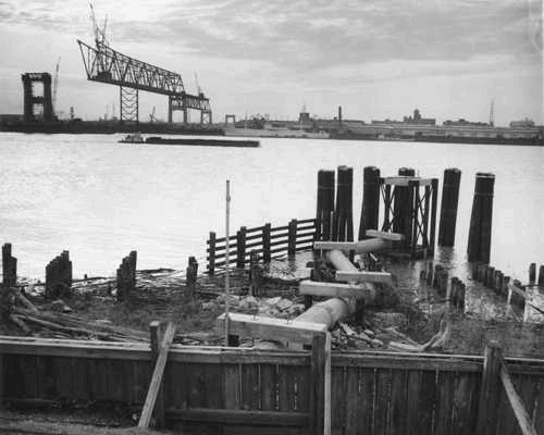 TodayInNewOrleansHistory/1957February1MississippiRiverBridgeUnderConstruction.jpg