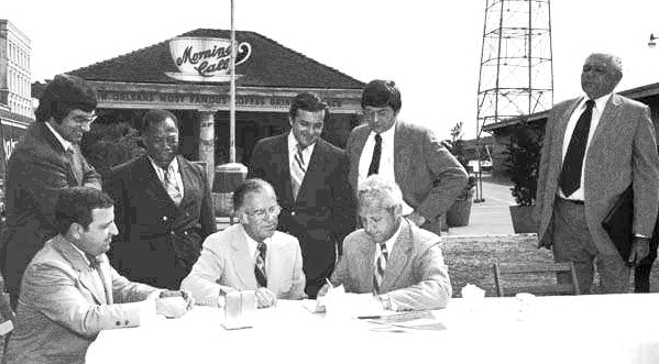 TodayInNewOrleansHistory/1973ClayShawMoonLandrieuRenovateFrenchMarketSigning.jpg